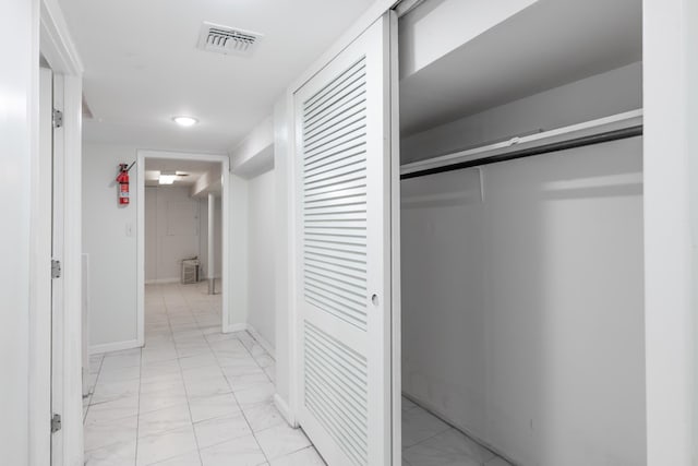 64 W 57th St, Bayonne, NJ 07002 - hall with light marble finish flooring and baseboards