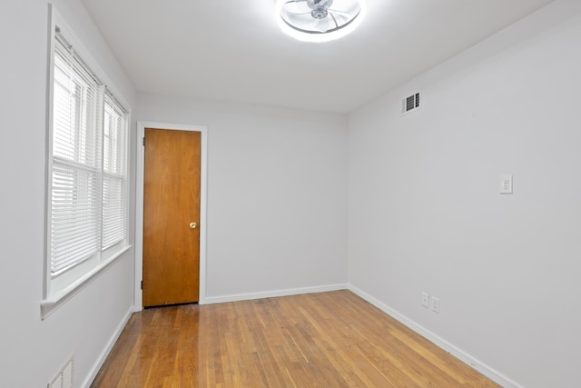 64 W 57th St, Bayonne, NJ 07002 - spare room featuring hardwood / wood-style floors and baseboards