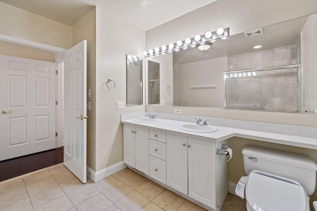 217 The Promenade Unit 217, Edgewater, NJ 07020 - bathroom with toilet, double vanity, baseboards, and tile patterned floors