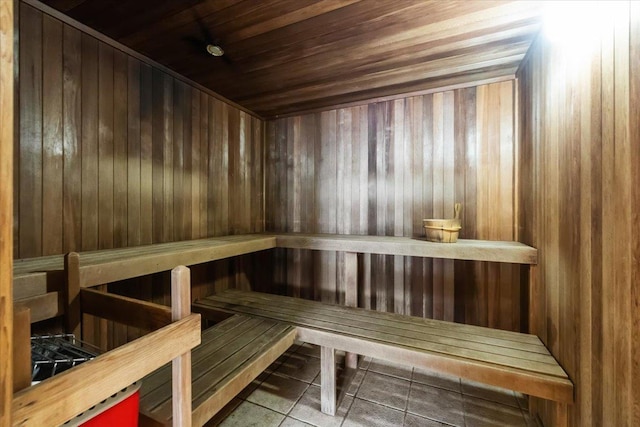 217 The Promenade Unit 217, Edgewater, NJ 07020 - relaxing sauna / steam room with tile patterned flooring, wood ceiling, and wood walls