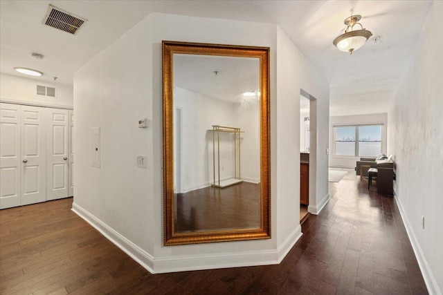 217 The Promenade Unit 217, Edgewater, NJ 07020 - hallway with dark wood-style flooring and baseboards