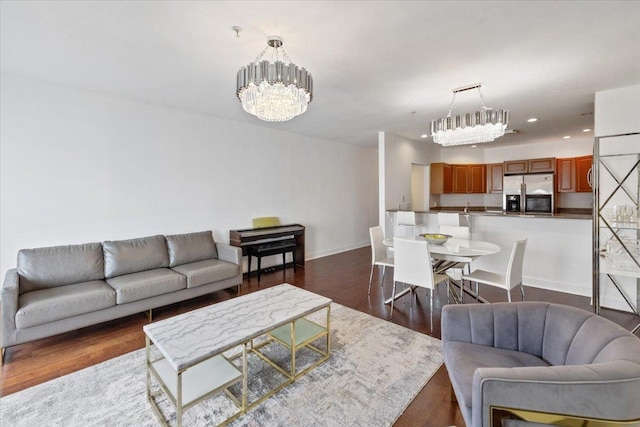 217 The Promenade Unit 217, Edgewater, NJ 07020 - living area with a chandelier, recessed lighting, dark wood-style flooring, and baseboards