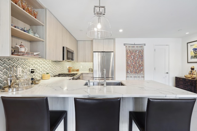 kitchen featuring decorative backsplash, appliances with stainless steel finishes, a peninsula, modern cabinets, and open shelves