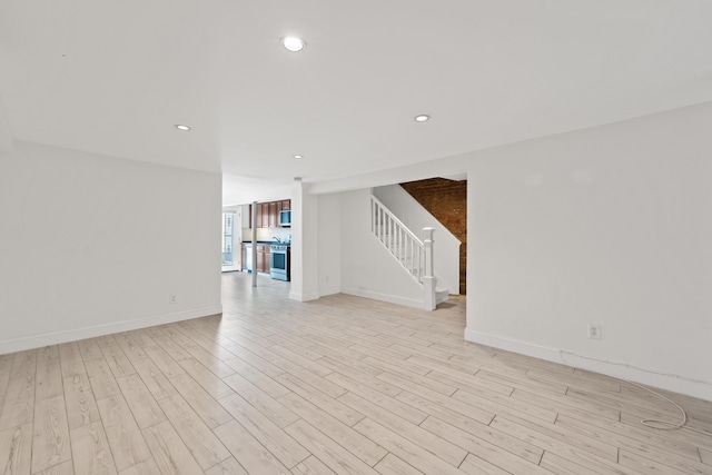 unfurnished living room with light wood-type flooring