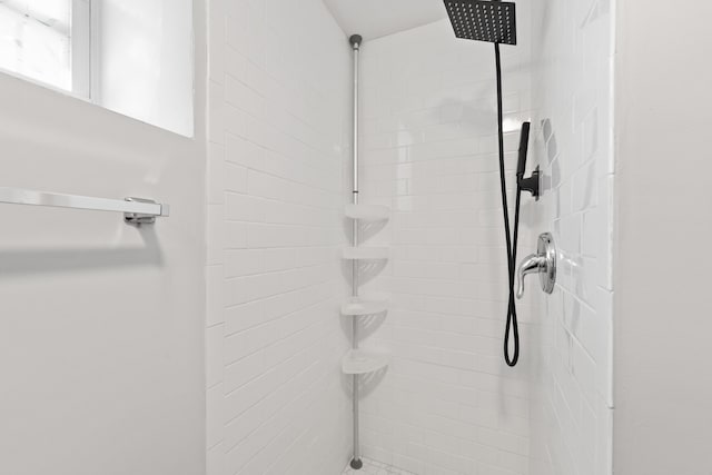 bathroom with tiled shower