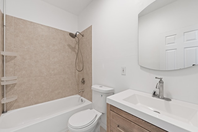 full bathroom featuring toilet, vanity, and tiled shower / bath