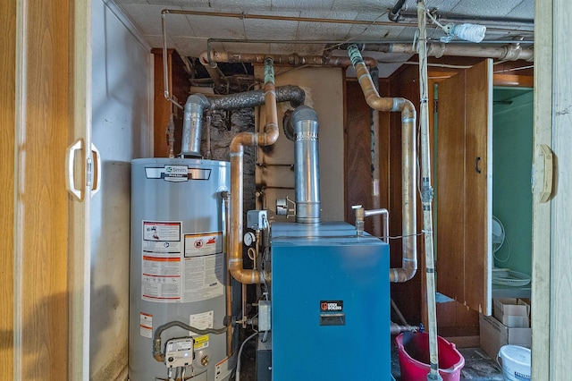 utility room featuring water heater