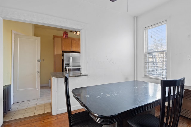 dining area with wood-type flooring