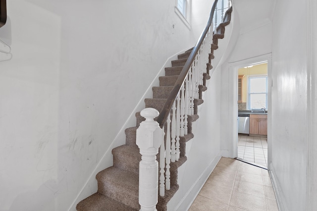 staircase with tile patterned flooring