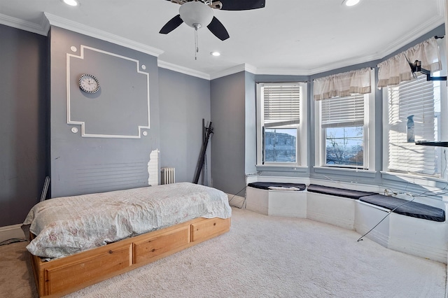 bedroom featuring carpet flooring, radiator, ceiling fan, and ornamental molding