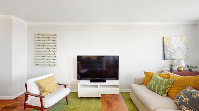 living area with crown molding, baseboards, and wood finished floors