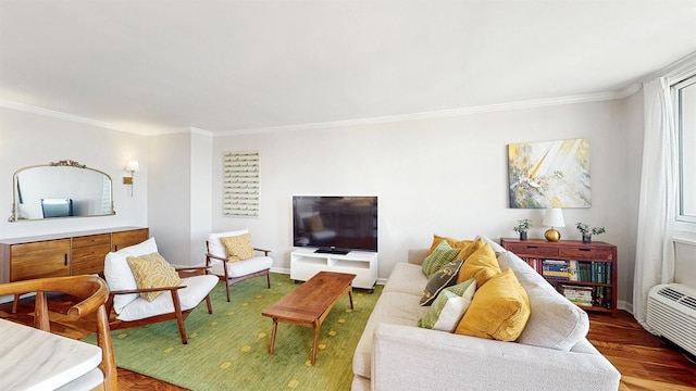 living room with baseboards, ornamental molding, and wood finished floors