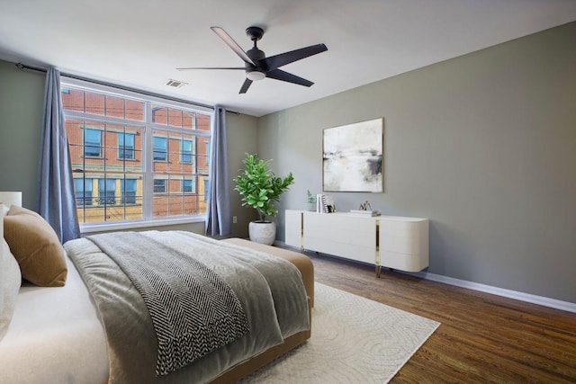 bedroom featuring ceiling fan and dark hardwood / wood-style floors