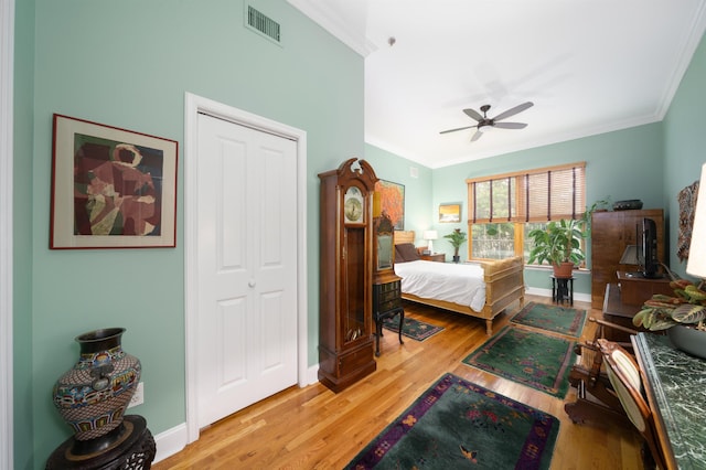 101 Park Ave Unit 3A, Hoboken, NJ 07030 - bedroom featuring crown molding, light wood-style flooring, baseboards, a closet, and ceiling fan