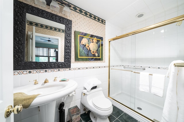 101 Park Ave Unit 3A, Hoboken, NJ 07030 - full bathroom featuring a shower stall, tile walls, toilet, wallpapered walls, and tile patterned floors