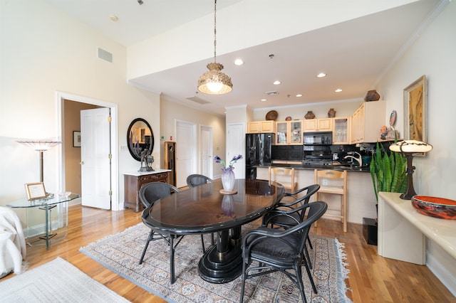 101 Park Ave Unit 3A, Hoboken, NJ 07030 - dining room with crown molding, light wood-type flooring, and recessed lighting