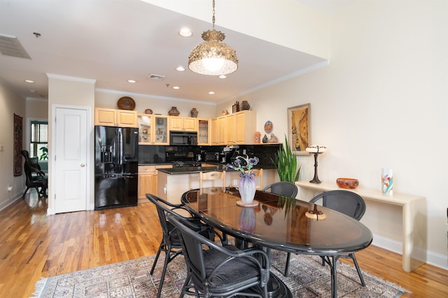 101 Park Ave Unit 3A, Hoboken, NJ 07030 - dining space featuring light wood finished floors, ornamental molding, baseboards, and recessed lighting