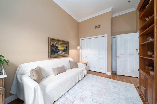 101 Park Ave Unit 3A, Hoboken, NJ 07030 - living room with crown molding, wood finished floors, and baseboards