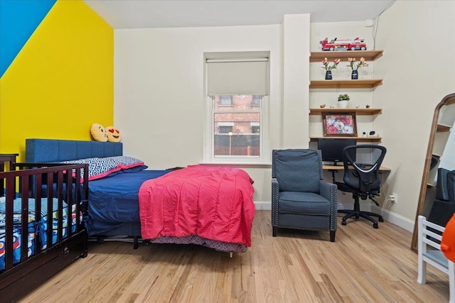 186 Wayne St Unit 118D, Jersey City, NJ 07302 - bedroom featuring wood finished floors, a desk, and baseboards