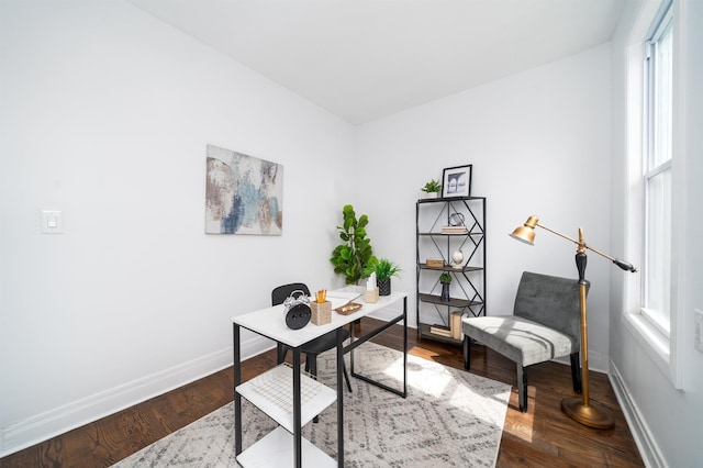 home office featuring dark wood-style flooring and baseboards