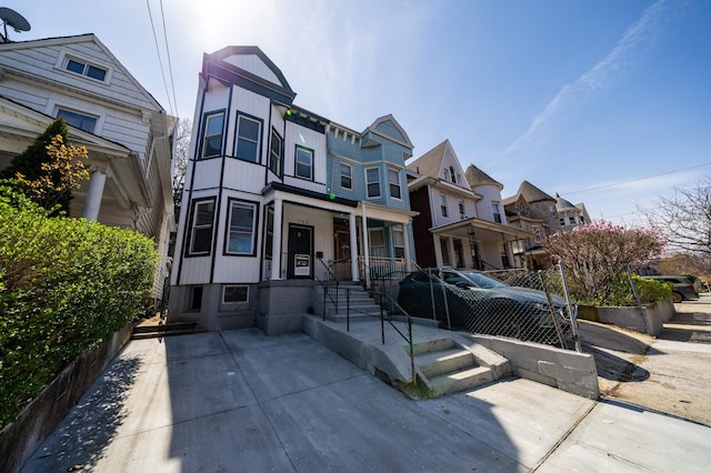 victorian home with a residential view
