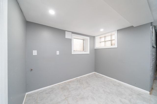 below grade area featuring baseboards and recessed lighting