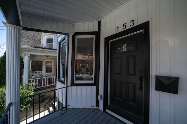 view of exterior entry with covered porch