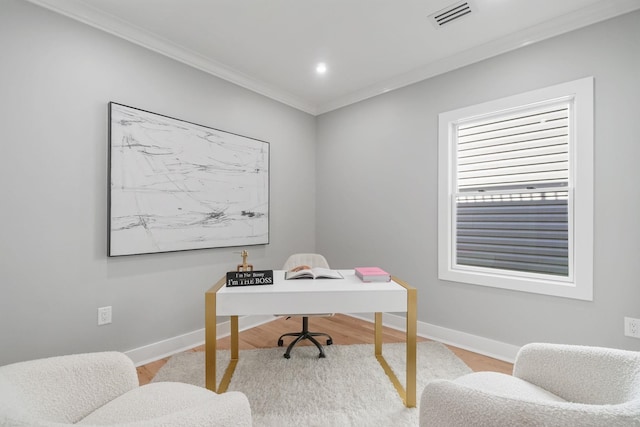 office featuring light hardwood / wood-style flooring and crown molding