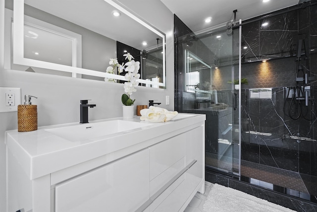 bathroom with vanity and an enclosed shower