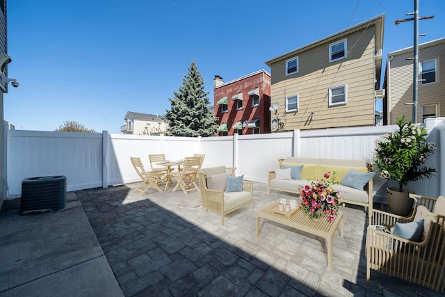 104 Poplar St Unit 1, Jersey City, NJ 07307 - fenced backyard with a patio area, outdoor lounge area, and outdoor dining space