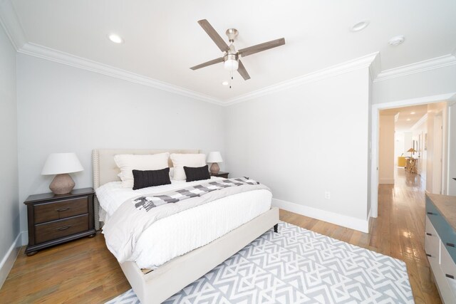 104 Poplar St Unit 1, Jersey City, NJ 07307 - bedroom with light wood finished floors, ornamental molding, recessed lighting, and a ceiling fan