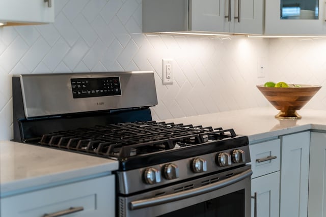104 Poplar St Unit 1, Jersey City, NJ 07307 - kitchen featuring gas stove and decorative backsplash