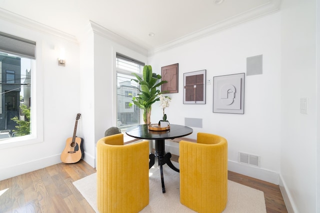 104 Poplar St Unit 1, Jersey City, NJ 07307 - dining room with ornamental molding and light wood-style flooring