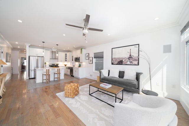 104 Poplar St Unit 1, Jersey City, NJ 07307 - living room featuring ornamental molding, ceiling fan, light wood-type flooring, and recessed lighting