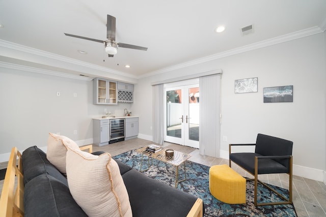 104 Poplar St Unit 1, Jersey City, NJ 07307 - living room with wine cooler, wet bar, light wood-type flooring, recessed lighting, and ornamental molding