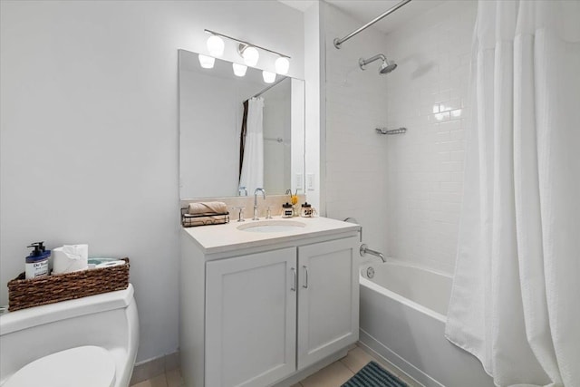 full bathroom with tile patterned floors, vanity, shower / tub combo, and toilet