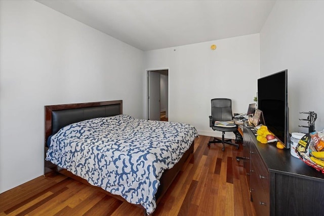 bedroom featuring dark hardwood / wood-style flooring