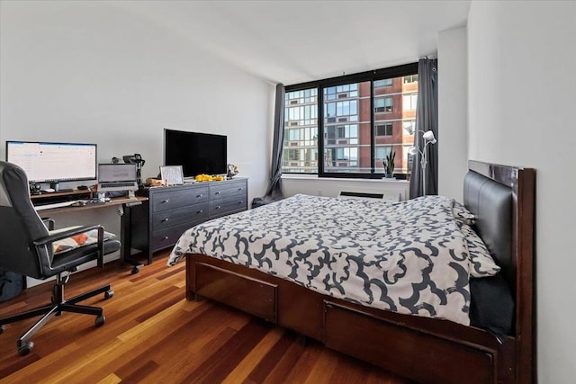 bedroom featuring hardwood / wood-style flooring