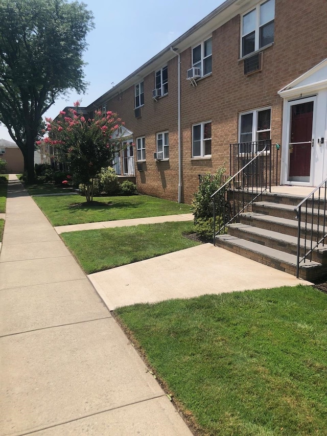 view of community featuring a yard