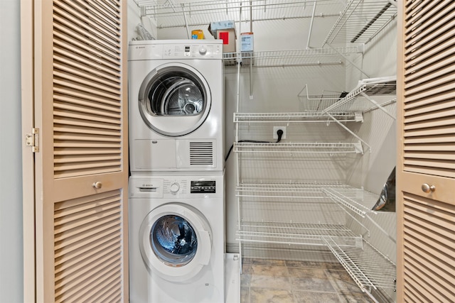 laundry room featuring stacked washer and dryer and laundry area