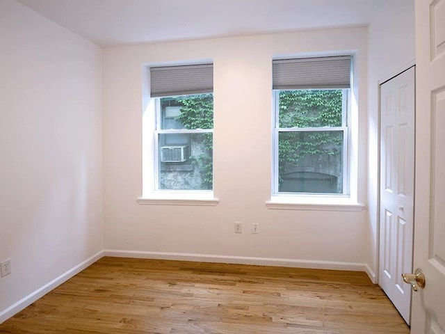 133 Lafayette St Unit 3R, Jersey City, NJ 07304 - empty room featuring light wood-style floors and cooling unit