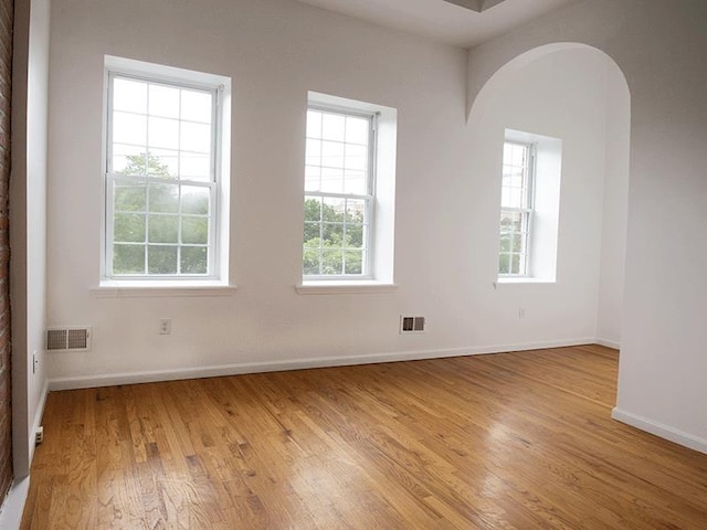 133 Lafayette St Unit 3R, Jersey City, NJ 07304 - unfurnished room featuring arched walkways and light wood-style flooring