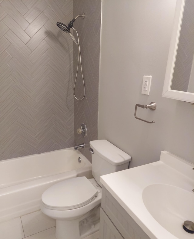 full bathroom featuring toilet, vanity, tile patterned floors, and tiled shower / bath