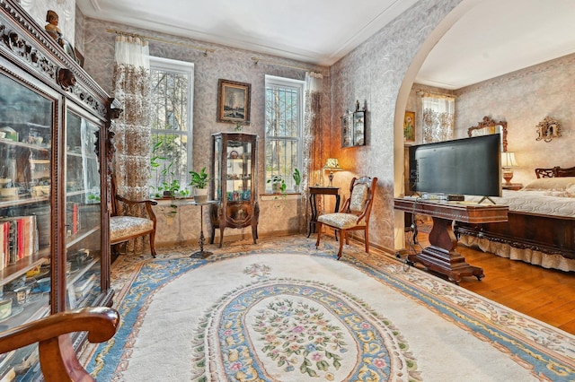 202 7th St Unit 1, Jersey City, NJ 07302 - sitting room featuring baseboards, arched walkways, crown molding, wood finished floors, and wallpapered walls