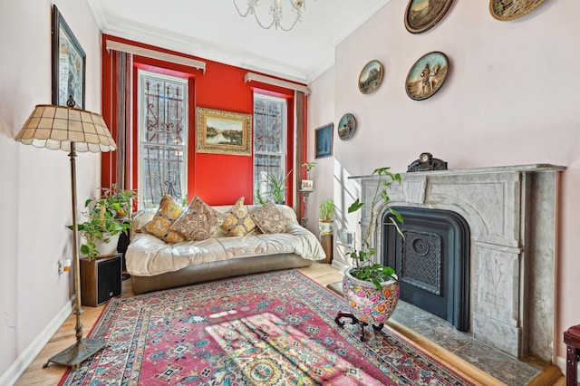 202 7th St Unit 1, Jersey City, NJ 07302 - living area featuring a fireplace with flush hearth, wood finished floors, baseboards, and ornamental molding