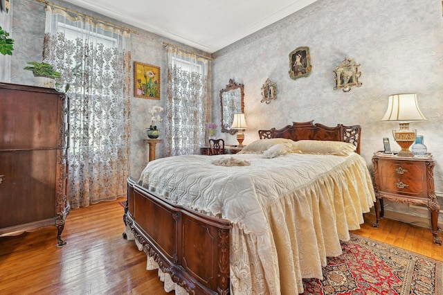 202 7th St Unit 1, Jersey City, NJ 07302 - bedroom featuring wallpapered walls, wood-type flooring, and ornamental molding