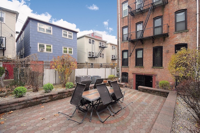 202 7th St Unit 1, Jersey City, NJ 07302 - view of patio / terrace with central AC unit, fence, and outdoor dining area