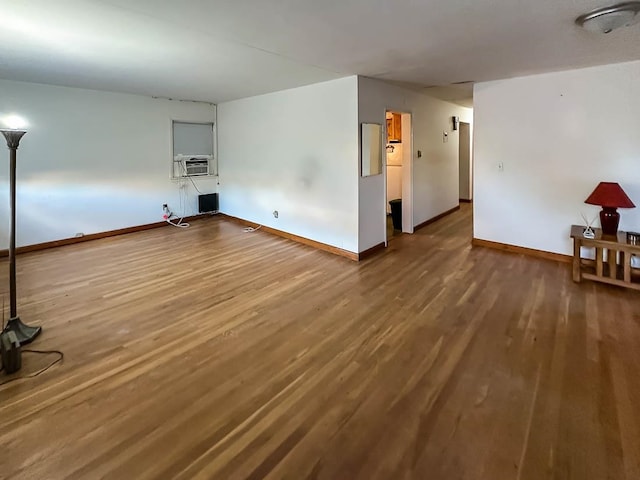 spare room featuring hardwood / wood-style flooring and cooling unit