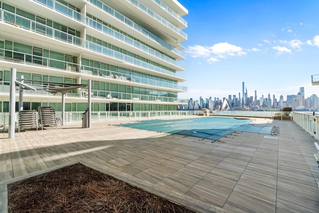 view of pool featuring a view of city