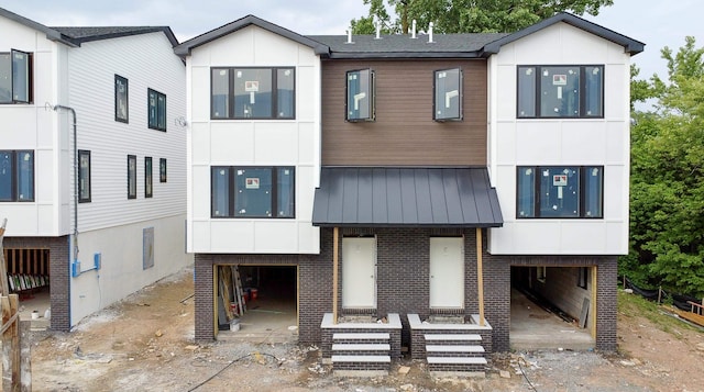 138 Weigands Ln, Secaucus, NJ 07094 - contemporary home with brick siding and a metal roof